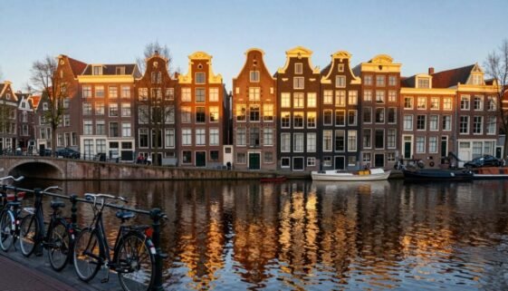 Amsterdam Canal Belt with historic houses reflecting in the water during golden hour