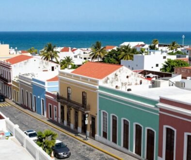 Colorful buildings in Old San Juan, Puerto Rico with the blue ocean visible in the background